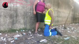 2 black studs having intercourse in public, one in his work uniform